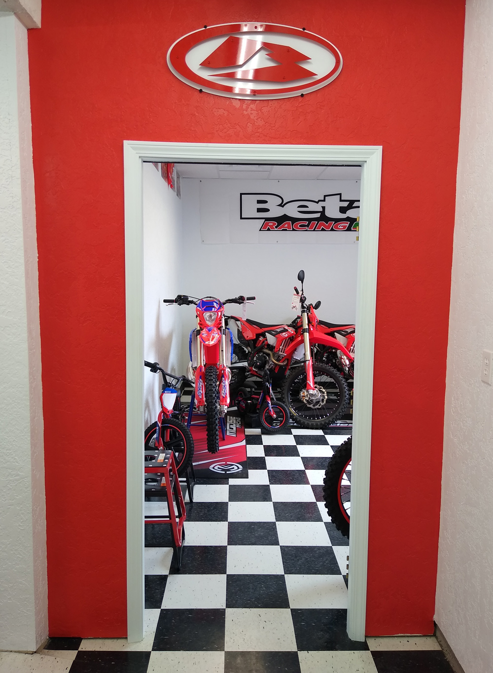 Doorway of Xtreme Heights Beta Racing room, filled with our latest inventory, parts, gear, and more!