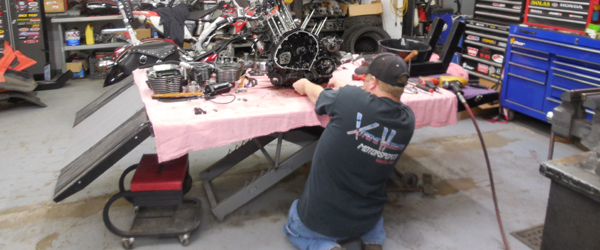 Brandon Zollman, owner of Xtreme Heights Motorsports is a certified technician. Working on a repair.